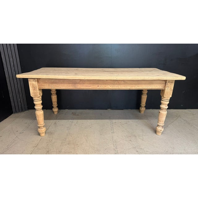 A Pine Farmhouse Dining Table dating to around the 1940s. Having a drawer in each end. In overall excellent original...