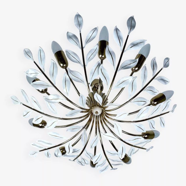 Large mid century pendant light featuring 10 brass curved spokes adorned with white leaves and handpainted gold highlight...