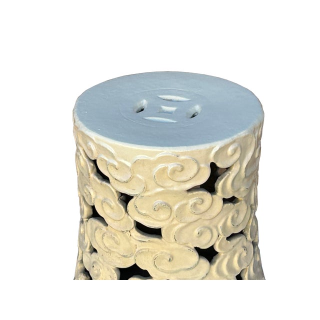 This is a beautiful cylindrical ceramic garden stool or side table, distinguished by its intricate openwork design and...