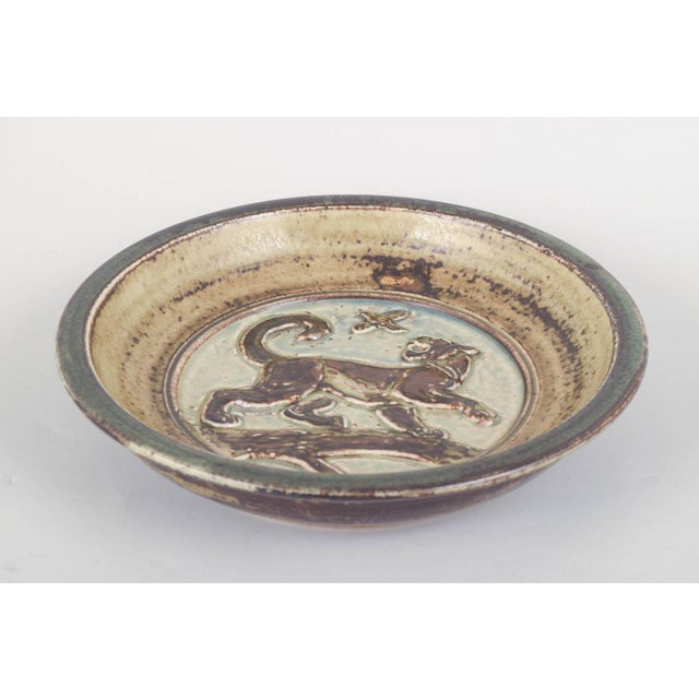 Knud Kyhn for Royal Copenhagen, stoneware dish. Round stoneware dish, model 21445, decorated in relief with a stylised...