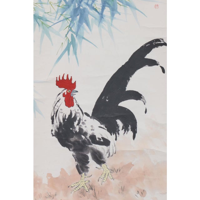 Chinese ink and color hanging scroll by famous modern artist Xu Beihong (1895-1953). It is titled “Rooster and Bamboo” and...