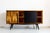 This sideboard was manufactured in Poland in the 1970s The case, drawer and door are finished in walnut veneer with a...