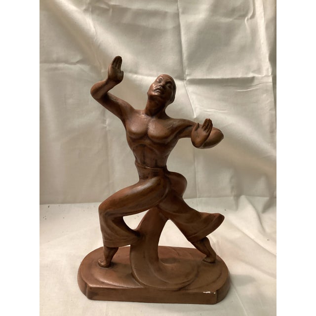 This vintage art – deco inspired ceramic sculpture features a gracefully posed male dancer. Captured in mid – movement...