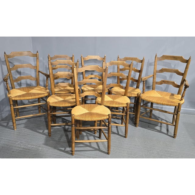 A very nice set of eight French oak dining chairs. with excellent quality rush seats, rare to find matching carvers...