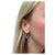 In a sleek and modern design, these Tiffany & Co. hoop earrings contain 58 round brilliant cut diamonds weighing 0.90...