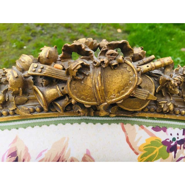 A fine pair of 19th century french fauteuil armchairs in giltwood. They have been finely carved with theatrical masks,...