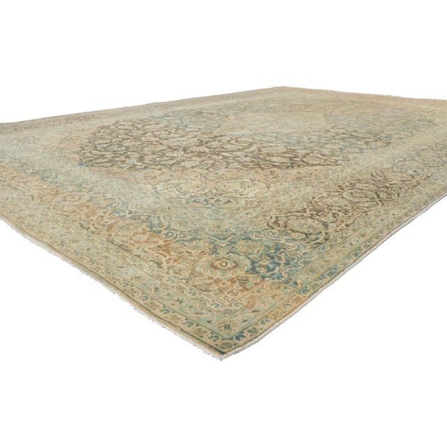 53747 Antique Persian Tabriz Rug, 09'08 x 13'08. Behold the glory of this hand knotted wool antique Persian Tabriz rug as...