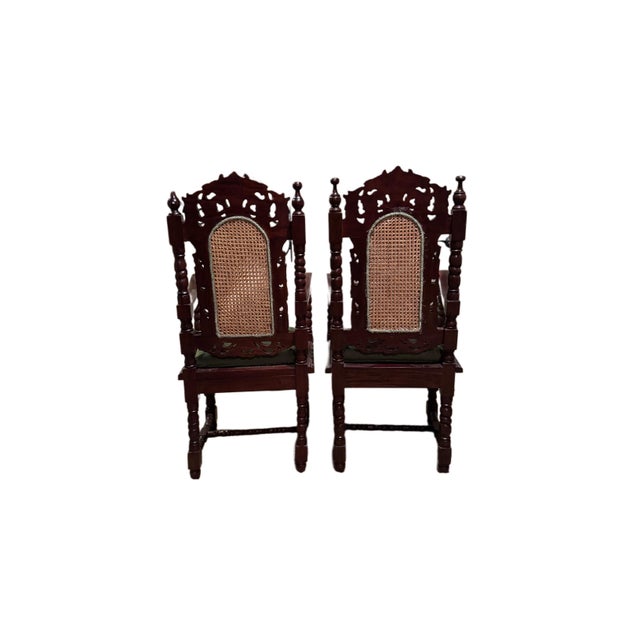A substantial pair of late 19th–early 20th century solid mahogany armchairs, dating to approximately 1890–1910, in a...