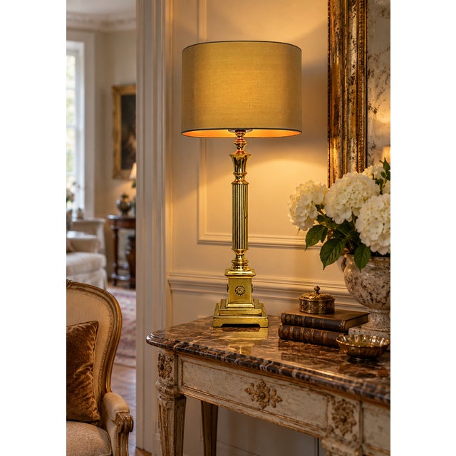 A distinctive and stately French table lamp from the 1960s. It is made of brass and stands 84 cm tall, including the oval...