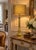 A distinctive and stately French table lamp from the 1960s. It is made of brass and stands 84 cm tall, including the oval...