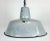 Industrial grey enamel pendant light made in Poland during the 1960s. White enamel inside the shade. Iron top. The...