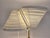 Early Artek A810 floor lamp, manufactured by Valaistustyö, designed by Alvar Aalto in 1959. The lamp has a brass base,...