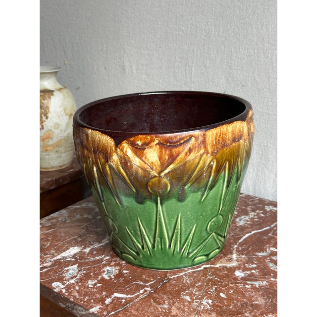 This RRP Art Deco Pottery Sun & Moon Planter is glazed with a distinctive majolica style green and brown drip glaze. It...