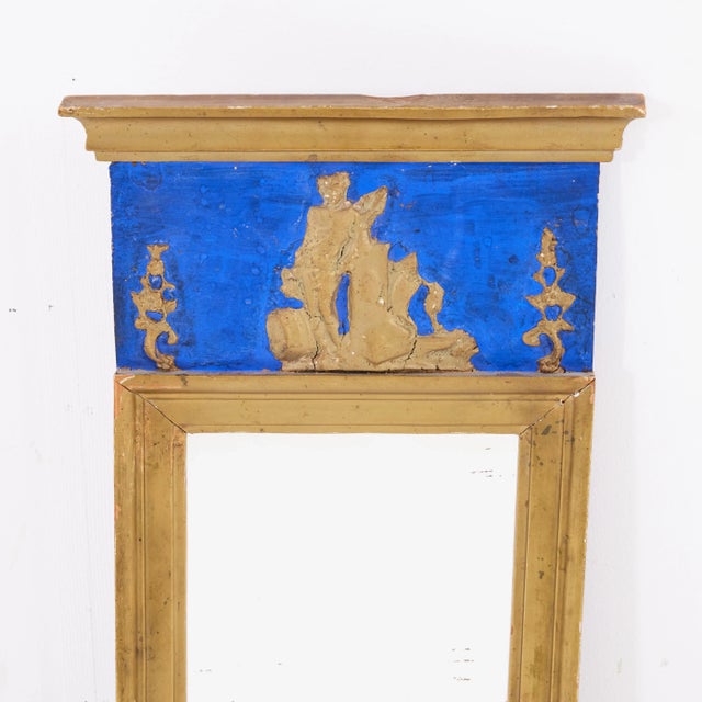 A mirror from the middle of the 19th century in Empire in Swedish. The mirror has a stamp as a seal. It is easy to see:...