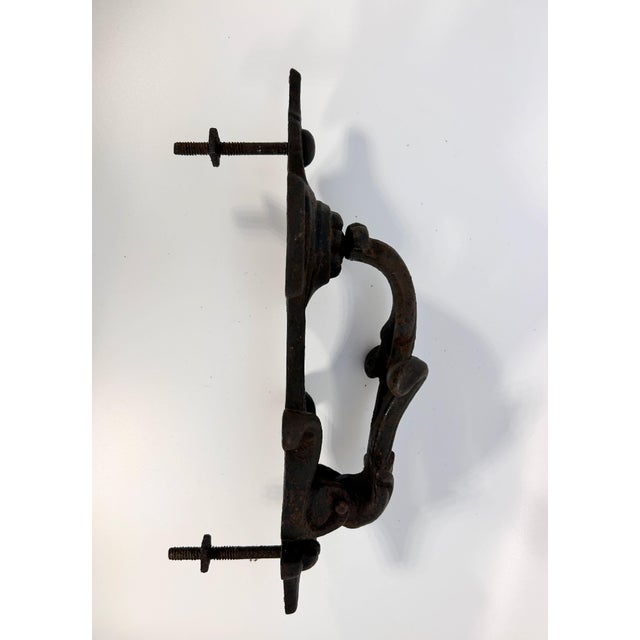 Antique wrought iron door knocker. Sourced in England. Includes mounting screws.