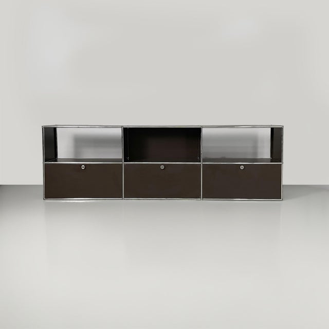 Swiss postmodern sideboard by USM Haller, 2000s Dark brown painted metal sideboard with tubular metal frame. The upper...