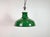 Industrial green enamel factory pendant light made in United Kingdom during the 1960s. White enamel inside the shade. Iron...