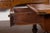 An English walnut parquet top table from the mid-19th century, with single drawer and turned legs. Created in England...