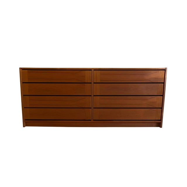 DESCRIPTION: A sharp, no-nonsense Danish modern lowboy with exactly what you want — long, clean lines and a warm teak tone...