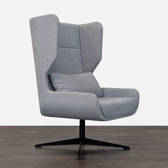 This NaughtOne lounge chair features a modern high-back design with comfortable armrests and a supportive headrest....