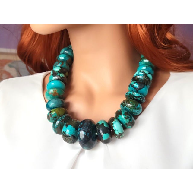 The length of the necklace is 22 inches (56 cm). The size of the rondelle beads varies from 16 mm to 40 mm. Turquoise...