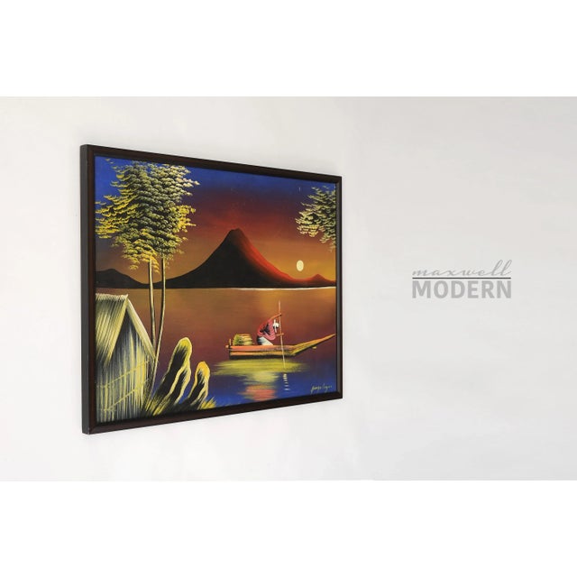 Colorful 1960s painting of a seafarer at moonlight in a tropical landscape. A beautiful prominent mountain is seen in the...