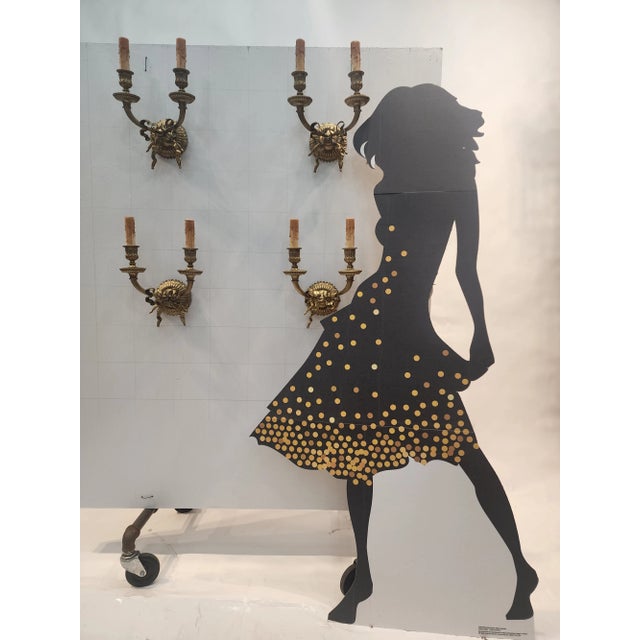 Gorgeous set of four gilded bronze heavy solid bronze structure sconces/appliques from France. Decorated by very elegant...