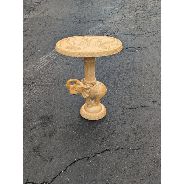 An exquisite vintage Chinoiserie side table, masterfully sculpted from substantial stone. This piece showcases intricate,...