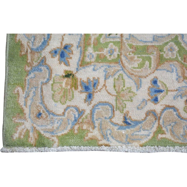 Hand-knotted with care using traditional rug-making techniques, this wool rug blends timeless craftsmanship with a modern...