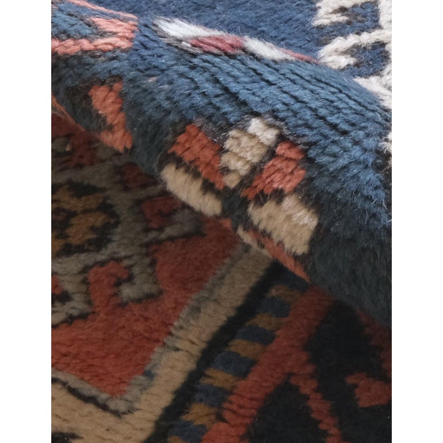 A vintage Persian rug is a handwoven textile crafted in Iran, typically over 30 years old, known for its intricate...