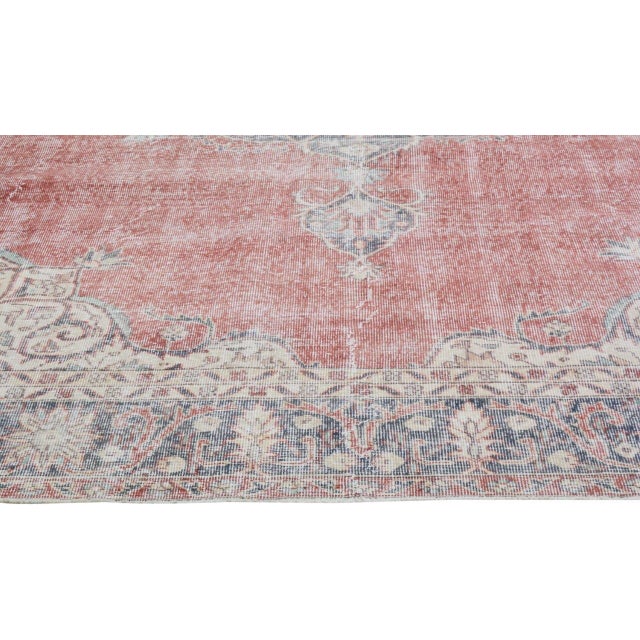 Hand-knotted with care using traditional rug-making techniques, this wool rug blends timeless craftsmanship with a modern...