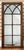 A handsome large rectangular window pane paneled mirror from England - featuring a burl walnut frame with decorative...