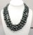This is part of Chairish’s Costume Jewelry assortment. Goldtone 3-strand black faux-baroque pearls with Modernist big...