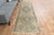 Vintage Hand-Knotted runner rug is a semi-antique vintage area rug. The '70s Eastern region of Anatolia's unique rug is...