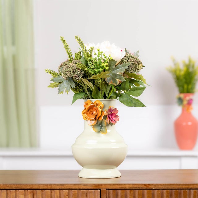 Bring sculptural beauty and garden-inspired charm into your home with this Embossed Floral Iron Vase. Featuring...