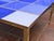 This square coffee table with blue mirrored Murano glass and brass trim is a stunning piece of modern design, handcrafted...
