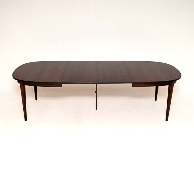 A stunning Danish vintage dining table by Gunni Omann. It was recently imported from Denmark, and dates from the 1960’s....