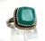 A striking solitaire ring showcasing an exceptionally rare grandidierite gemstone, prized among collectors for its...