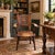 Antique Jacobean Revival carved oak armchair, circa 1900, featuring a distinctive heraldic shield with two crosses,...