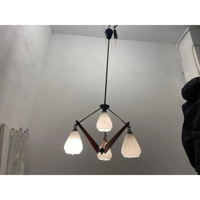 Opaline Glass Light Pendant 1950’s Height with rod 100 cm Brass and wooden veneer central piece Height without rod 35 cm...