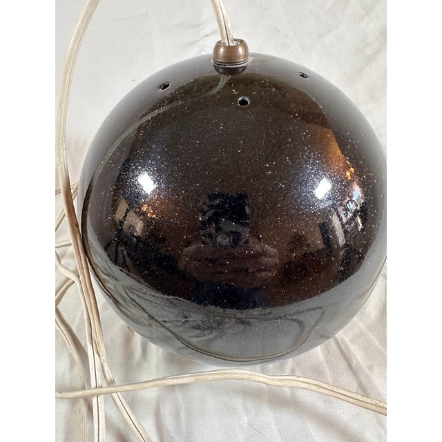 Super cool, eyeball pendant light With sparkle powder coat. Must see absolutely cool.