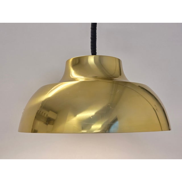 Pendant lamp "Pamela" by finnish designer Heikki Turunen, and manufactured by Orno, Finland. The lamp has beautiful brass...