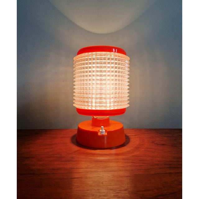 Vintage orange and clear plastic table lamp, 1960s. The electrical plug has been replaced. Compatible with a B22 LED bulb....