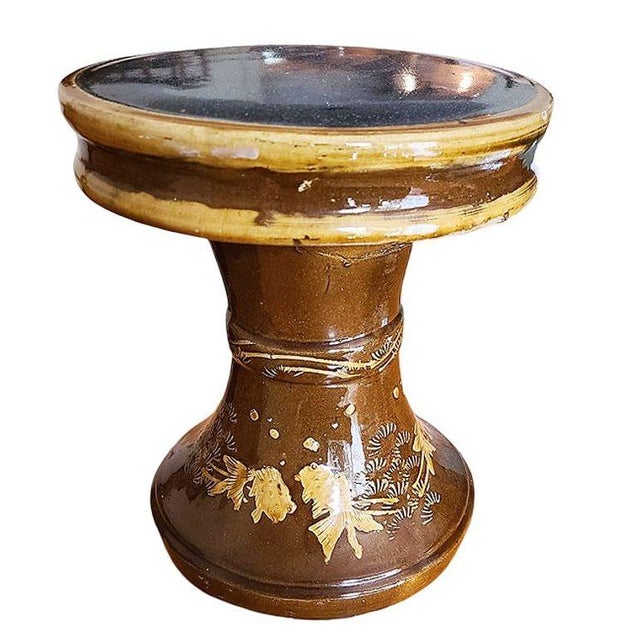 Original set of glazed art pottery garden furniture set featuring a set of 4 toadstool-shaped stools featuring a relief of...