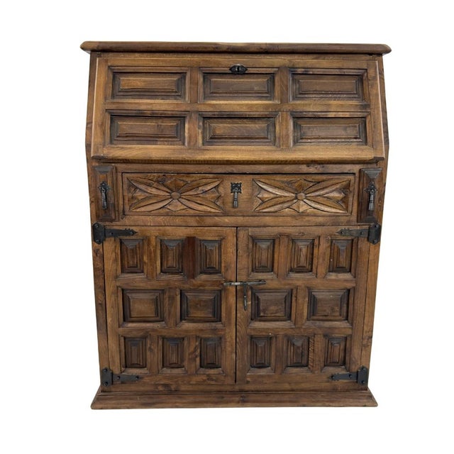 Dimensions: H 41.5” x W 33” x D 11” Brutalist Spanish carved wood secretary cabinet manner of Navarro Argudo with single-...