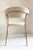 Particular contemporary chair with polished brass structure and cream-colored velvet covering. Period: Contemporary...