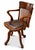 Victorian English Antique Oak & Leather Rail Back Revolving Desk Chair With Stud Detailing With a dark Olive green seat. A...