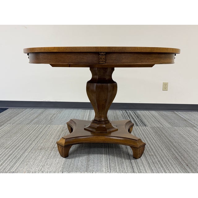 -DINING TABLE W/3-EXTENSIONS - PEDESTAL BASE -MANUFACTURE: ROMWEBER -IN THE STYLE OF: MID-CENTURY -DATE OF MANUFACTURE:...