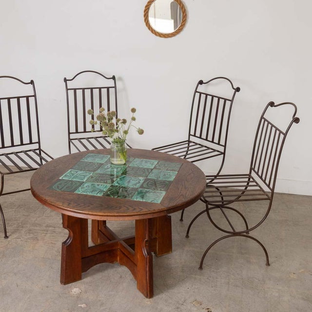 Lovely set of 4 iron outdoor dining chairs from France, 1940s. Beautiful scroll iron design on back with slated iron back...