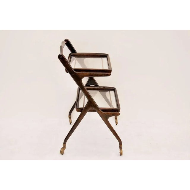 Bar cart attributed to Cesare Lacca, Year 1950, Made in Italy. Beautiful 1950 bar cart, wood and brass, with two removable...